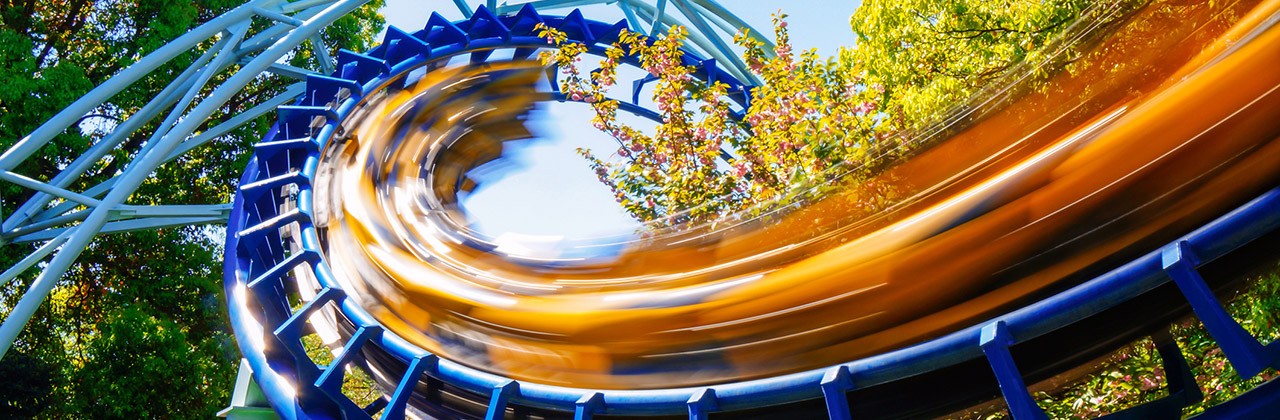 A roller coaster going into a corkscrew
