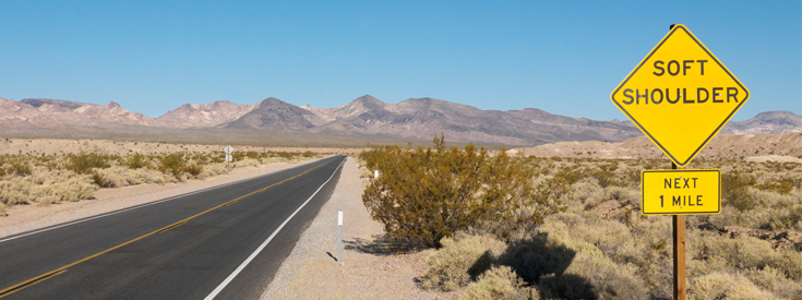 Highway soft shoulder desert side of road sign