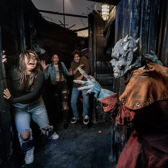 Monster scares teenage girl at Knott's Scary Farm