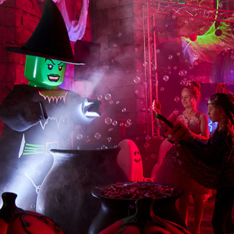 Lego witch with kids at Brick or Treat Halloween