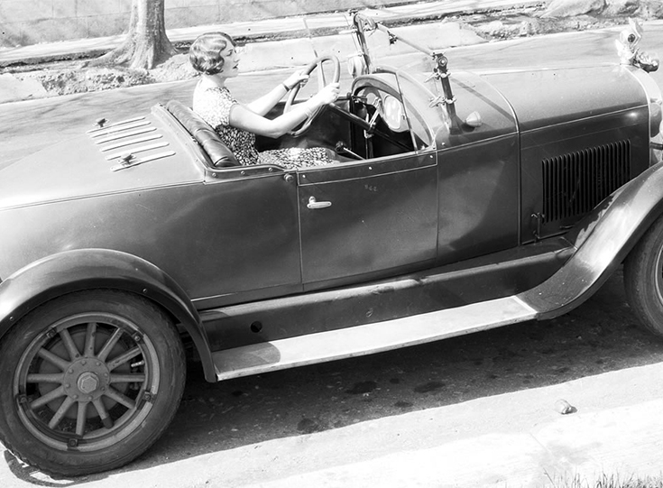 1923 girl sitting in auto