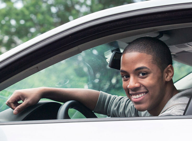 Young man in car learning to drive