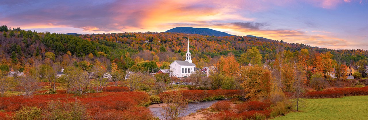 Panorama of Stowe Church in Vermont surrounded by the beautiful fall foliage