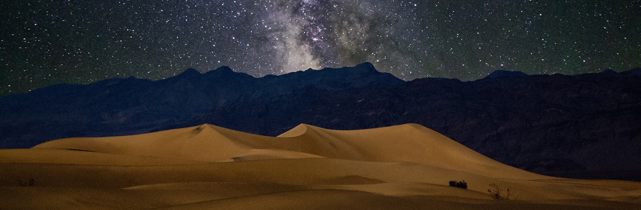 Death Valley sand dunes at night beneath the stars of the Milky Way