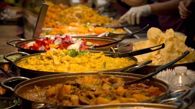 Pans of Indian food being cooked in London