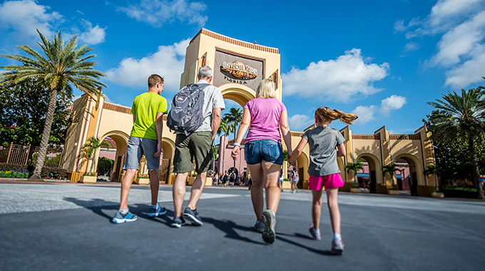 A family approaching the entrance to Universal Studios Florida