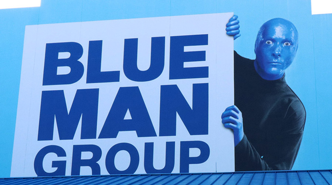 A Blue Man Group sign