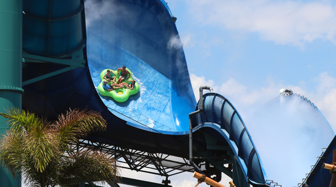 Riders suspended vertically on the Honu water slide