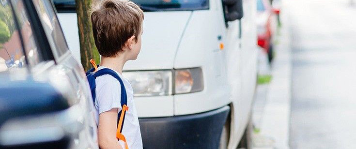 Boy looking before crossing street Boy looking before crossing street