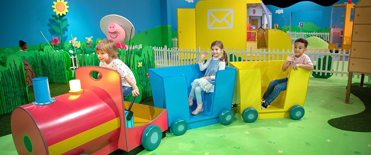 Kids riding train at Peppa Pig World of Play. Kids riding train at Peppa Pig World of Play.