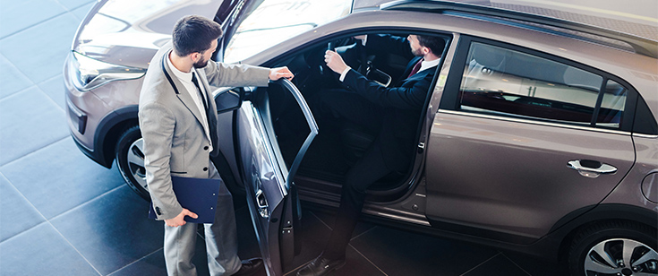 Car salesman helping customer Car salesman helping customer
