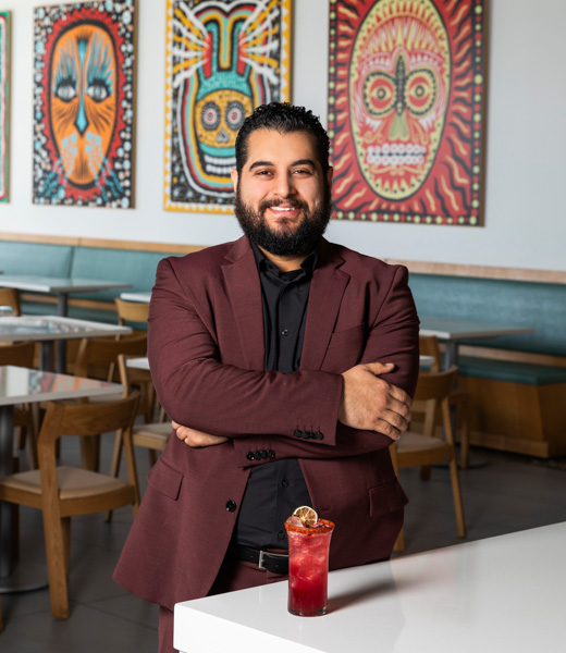 William Fernandez with his Sayulita mocktail inside Urbe.