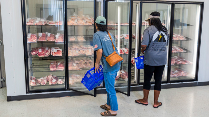 Shoppers browsing the selection at Lambert Powell Meats