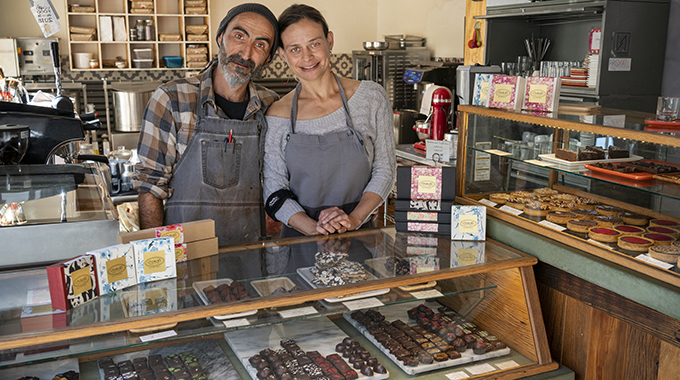 Javi Abad and Debi Vincent behind the counter at their store Chokola