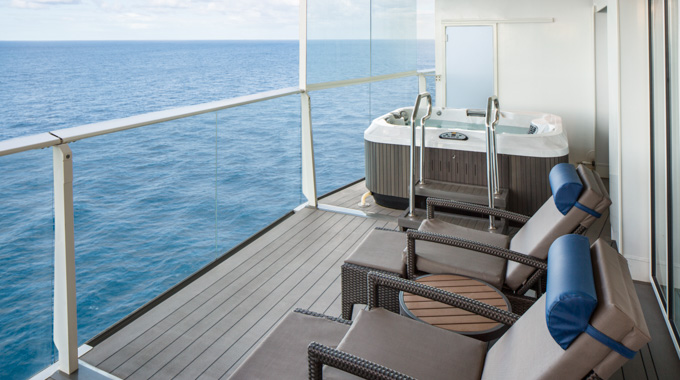 Villa Suite balcony with lounge chairs and a private whirlpool