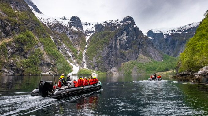 Passengers exploring remote fjords on an expedition boat.