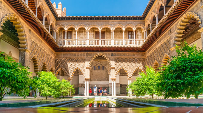 The Gardens of the Real Alcázar Palace in Seville, Spain. 