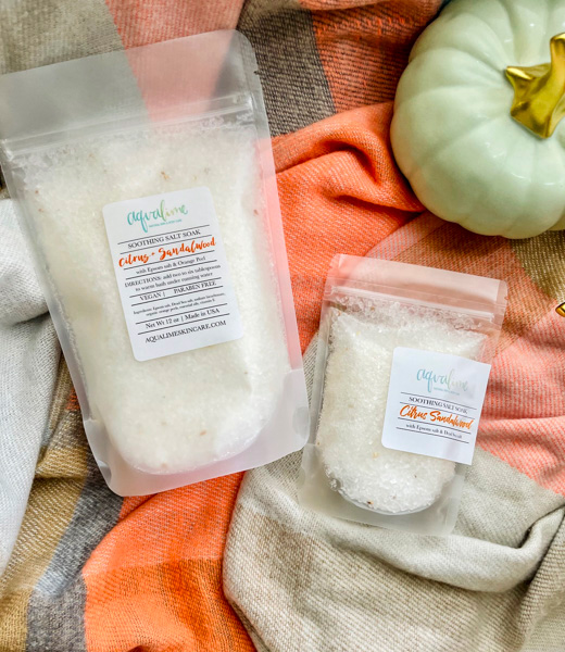 Bags of citrus and sandalwood salt soak from Aqualime Skincare.