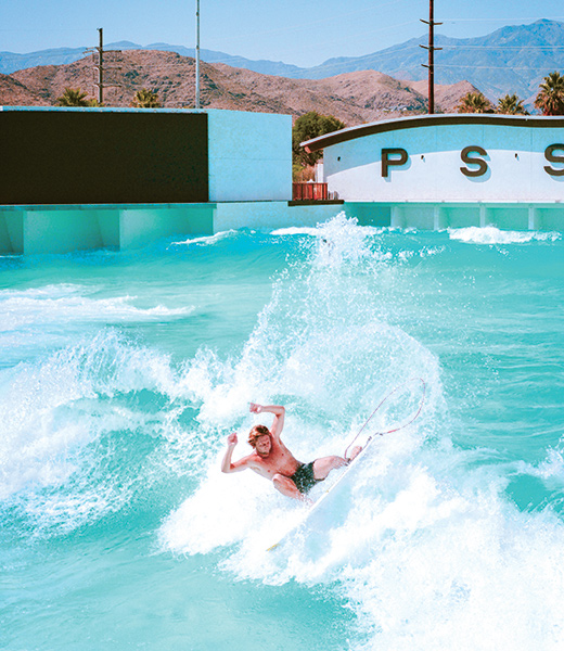 Man surfing in a wave pool.