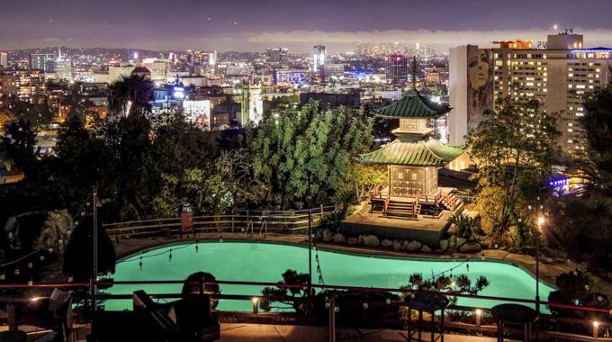 Yamashiro's pagoda with cityscape at night.