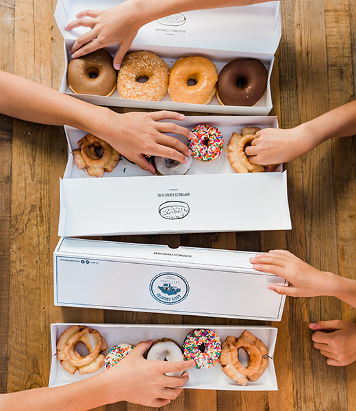 Boxes of doughnuts from God’s Country Provisions