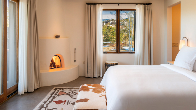 Four Seasons Resort Rancho Encantado casita interior with kiva fireplace.