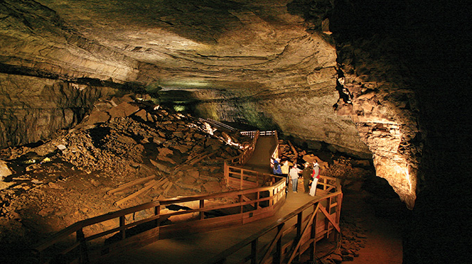 Visitors inside the Broadway passage in Mammoth Cave.